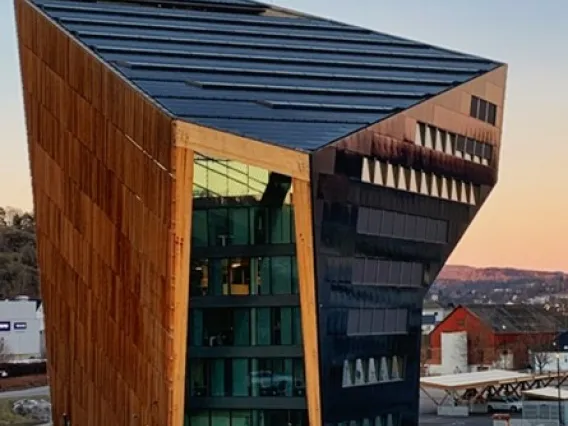 A building with unique architecture at sunset